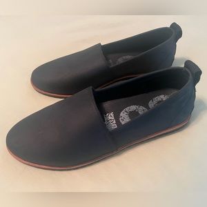 NWOT Sorel waterproof shoes. Women’s black flats with subtle rugged sole. Size 9